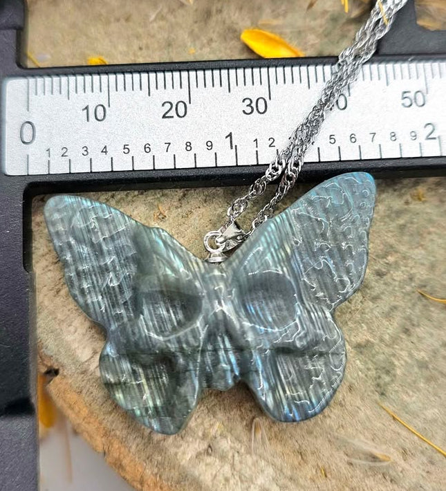 Labradorite carved hidden skull butterfly pendant necklace close-up view — My Aura Gemstones