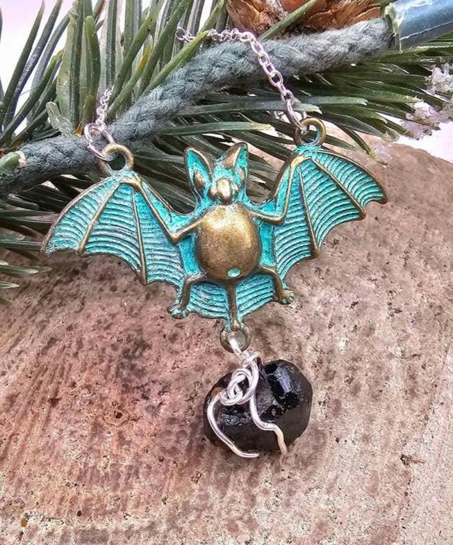 Black tourmaline flying bat pendant, different angle, part of the Protection & Grounding Duo - My Aura Gemstones