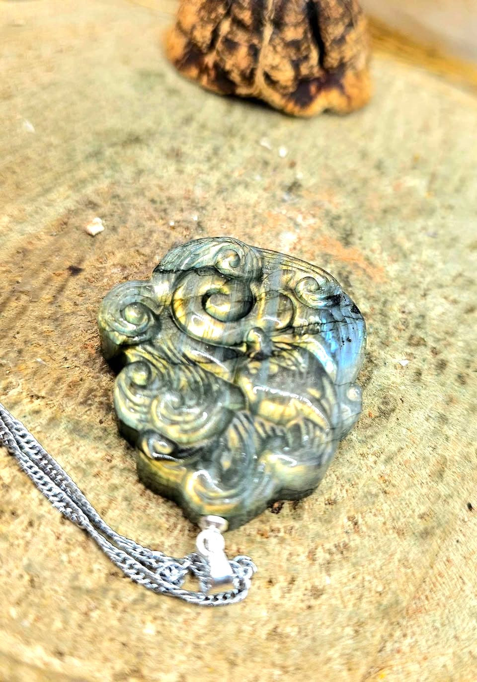 Labradorite carved elegant nine tails fox looking back pendant worn view — My Aura Gemstones