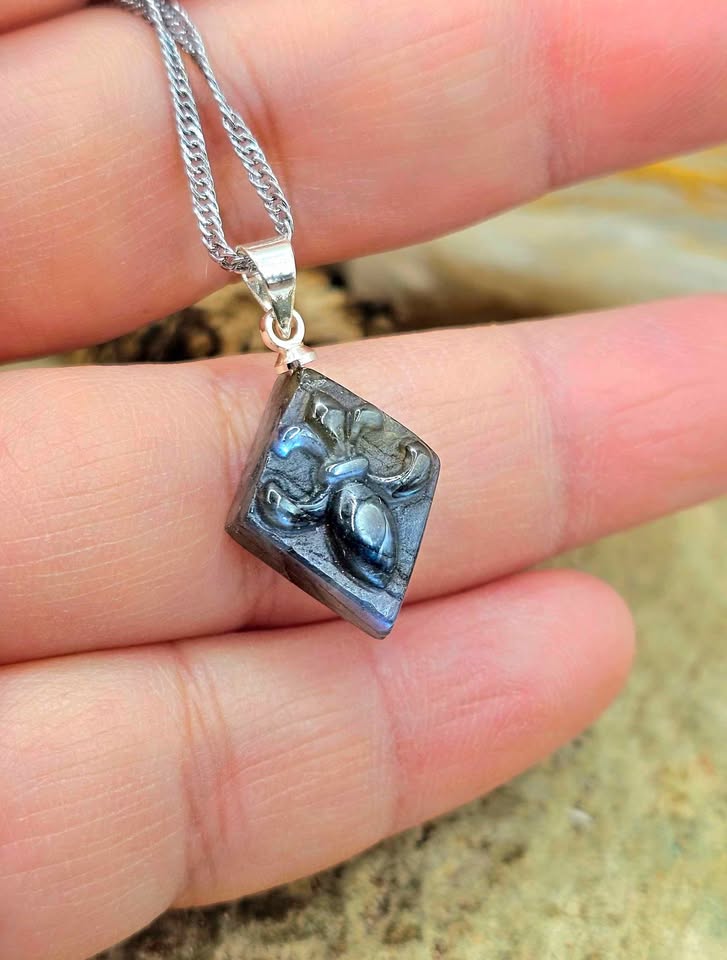 Labradorite carved fleur-de-lis symbol tile pendant necklace worn view — My Aura Gemstones