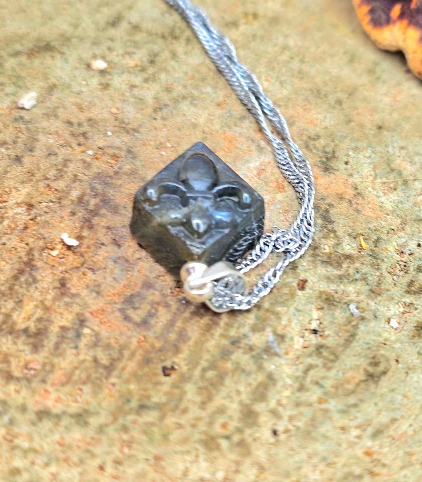 Labradorite carved fleur-de-lis symbol tile pendant necklace lifestyle view — My Aura Gemstones