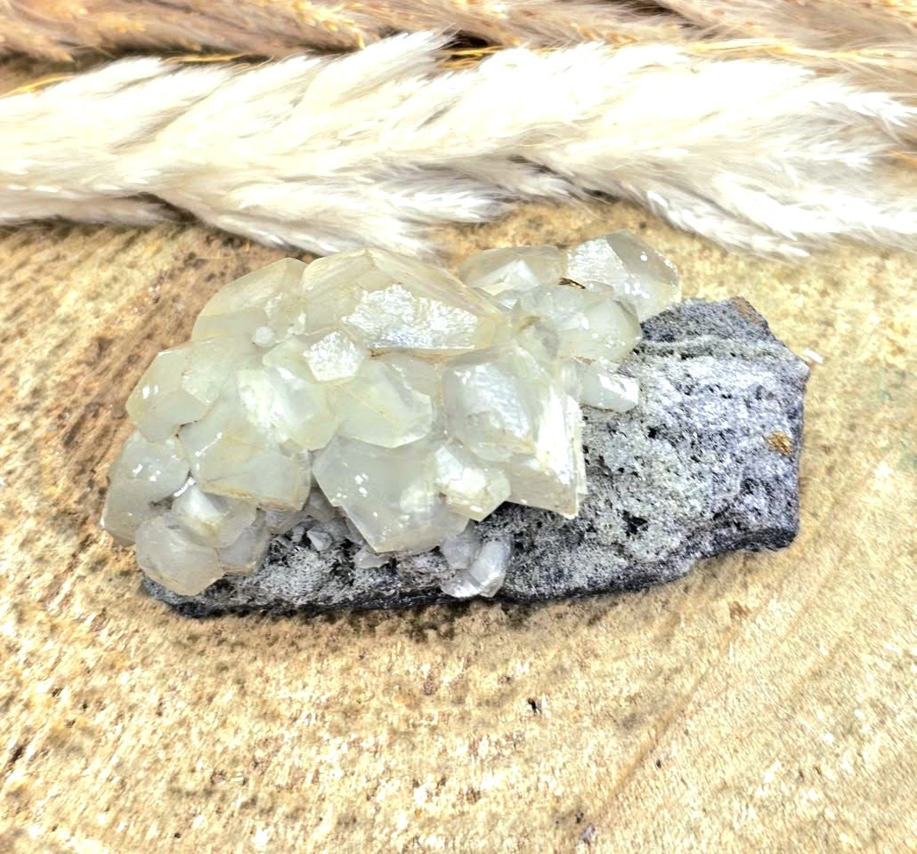 Calcite crystal cluster with pyrite on a sparkling dark matrix 