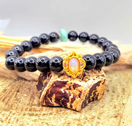 Black obsidian bracelet with turquoise donut and gold opal charm, 10mm natural crystal beads. My Aura Gemstones