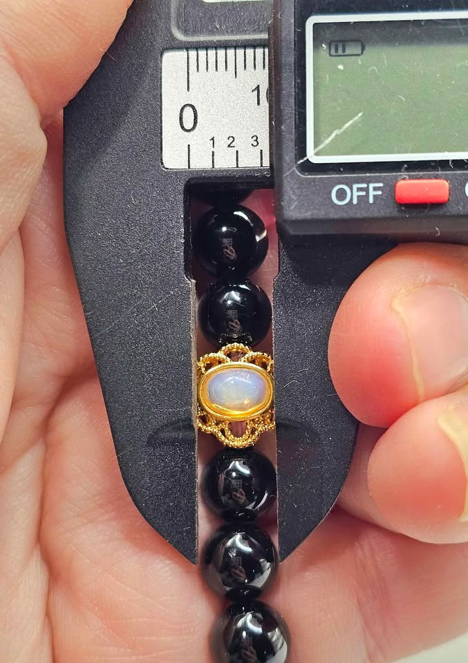 Black obsidian bracelet with turquoise donut and gold opal charm, 10mm natural crystal beads. My Aura Gemstones