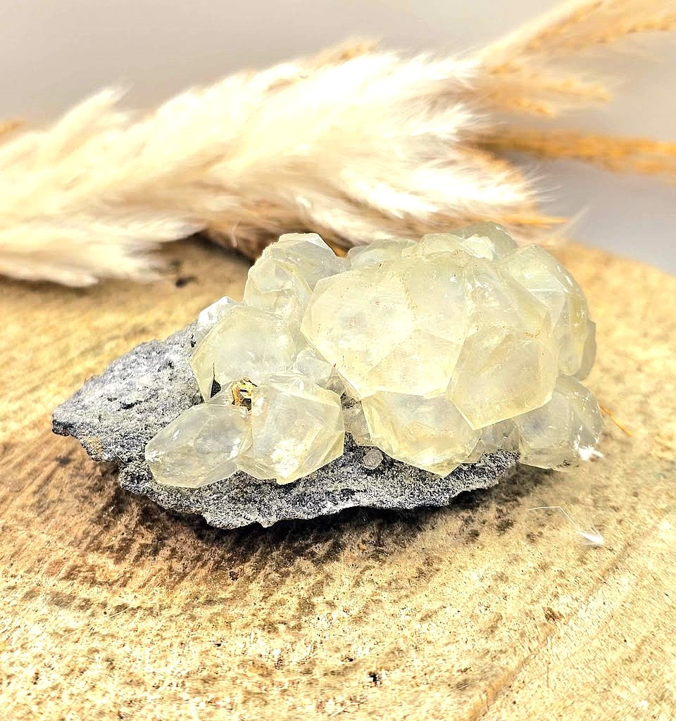 Calcite crystal cluster with pyrite on a sparkling dark matrix 