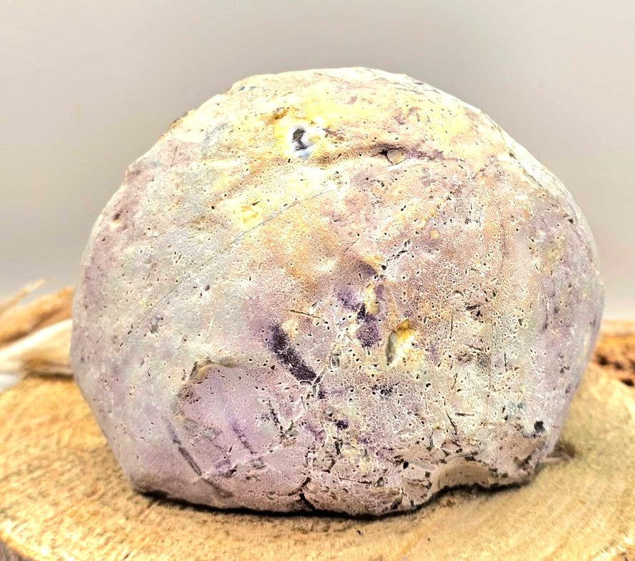 Natural druzy geode crystal with sparkling cavern displayed on white background, polished slice showing layered mineral bands-My Aura Gemstones