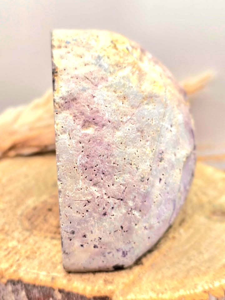 Natural druzy geode crystal with sparkling cavern displayed on white background, polished slice showing layered mineral bands-My Aura Gemstones