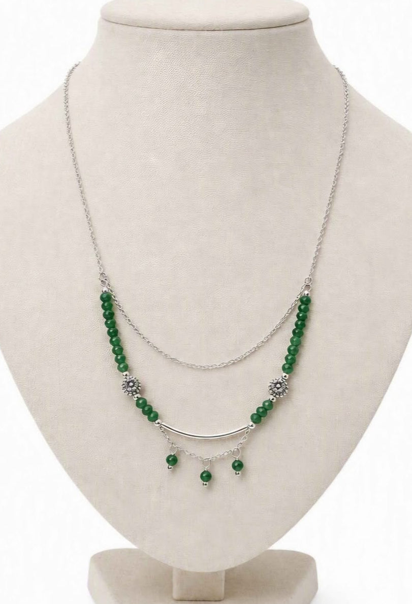 “Handmade strawberry quartz necklace with faceted flashy beads and multi‑chain hanging drop design on silver accents