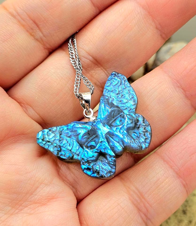 Labradorite carved hidden skull butterfly pendant necklace flash close-up — My Aura Gemstones