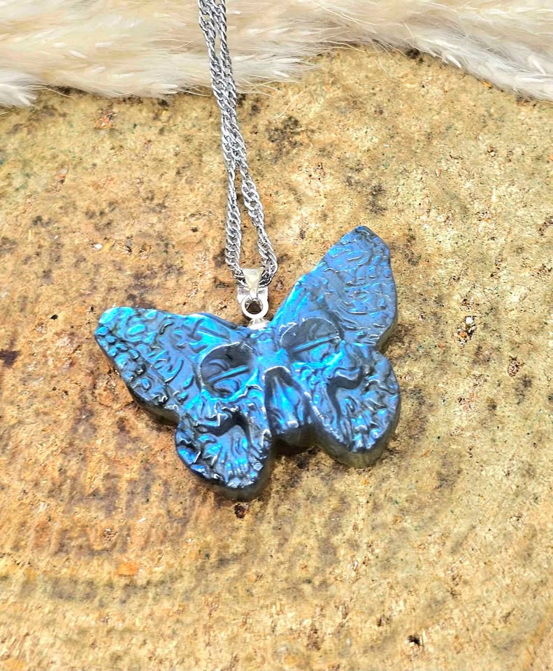 Labradorite carved hidden skull butterfly pendant necklace flash close-up — My Aura Gemstones