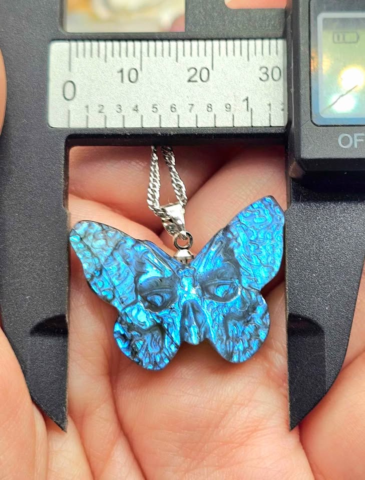 Labradorite carved hidden skull butterfly pendant necklace flash close-up — My Aura Gemstones