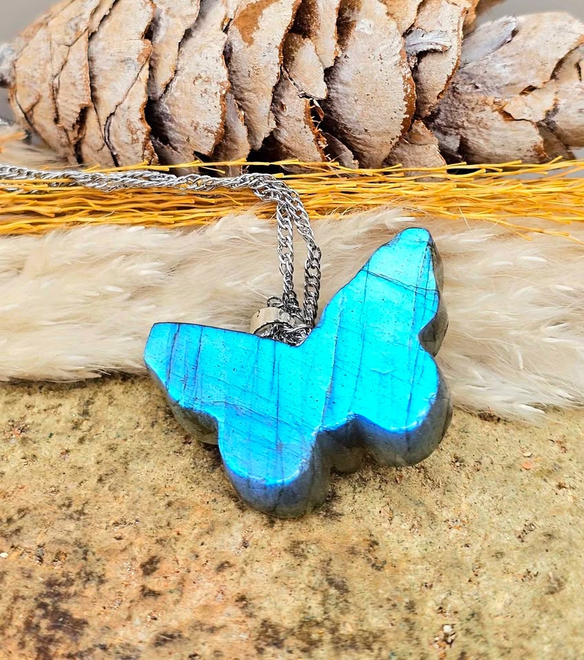 Labradorite carved hidden skull butterfly pendant necklace flash close-up — My Aura Gemstones