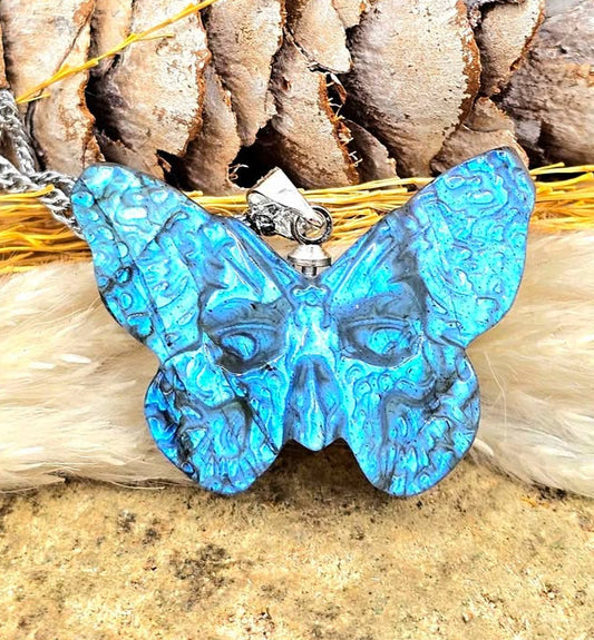 Labradorite carved hidden skull butterfly pendant necklace flash close-up — My Aura Gemstones