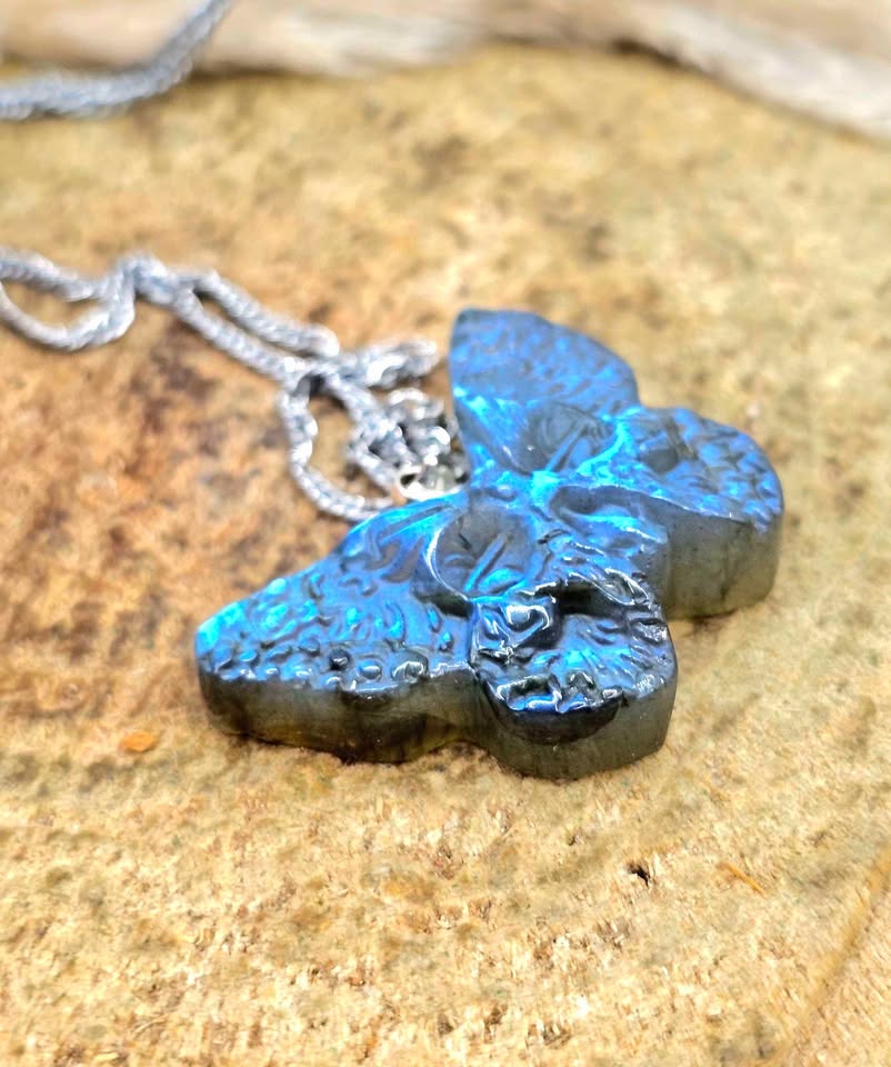 Labradorite carved hidden skull butterfly pendant necklace flash close-up — My Aura Gemstones