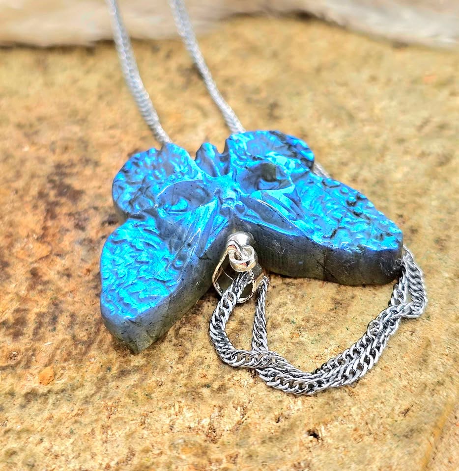Labradorite carved hidden skull butterfly pendant necklace flash close-up — My Aura Gemstones