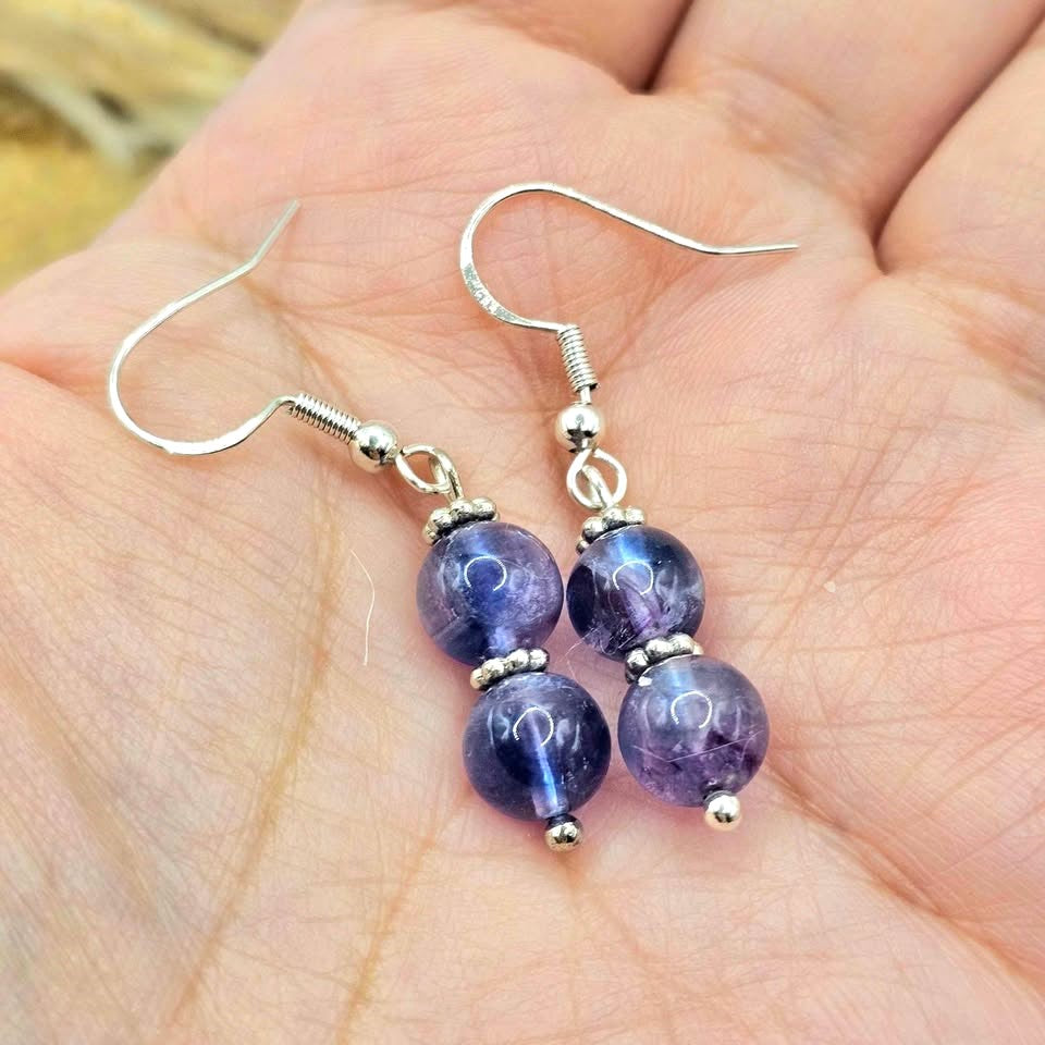 Handcrafted purple fluorite dangle earrings with 7mm lavender‑to‑violet beads, silver‑tone spacers, and S925 stamped fishhook ear wires.-My Aura Gemstones