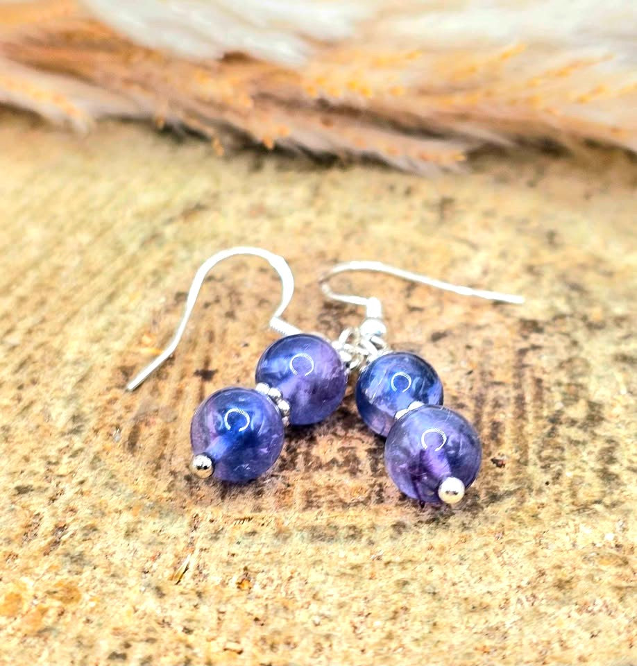 Handcrafted purple fluorite dangle earrings with 7mm lavender‑to‑violet beads, silver‑tone spacers, and S925 stamped fishhook ear wires.-My Aura Gemstones