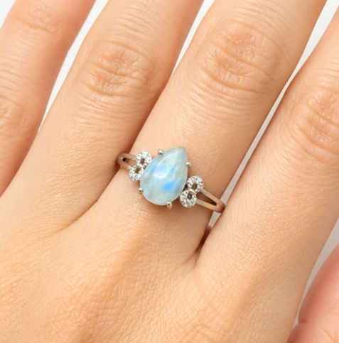 Natural translucent blue kyanite teardrop ring with clear quartz mix and adjustable rhinestone‑stacked band. My Aura Gemstones