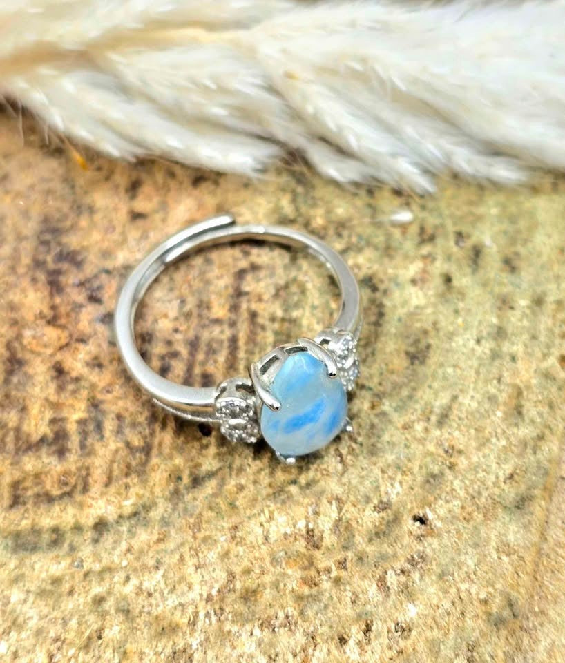 Natural translucent blue kyanite teardrop ring with clear quartz mix and adjustable rhinestone‑stacked band. My Aura Gemstones