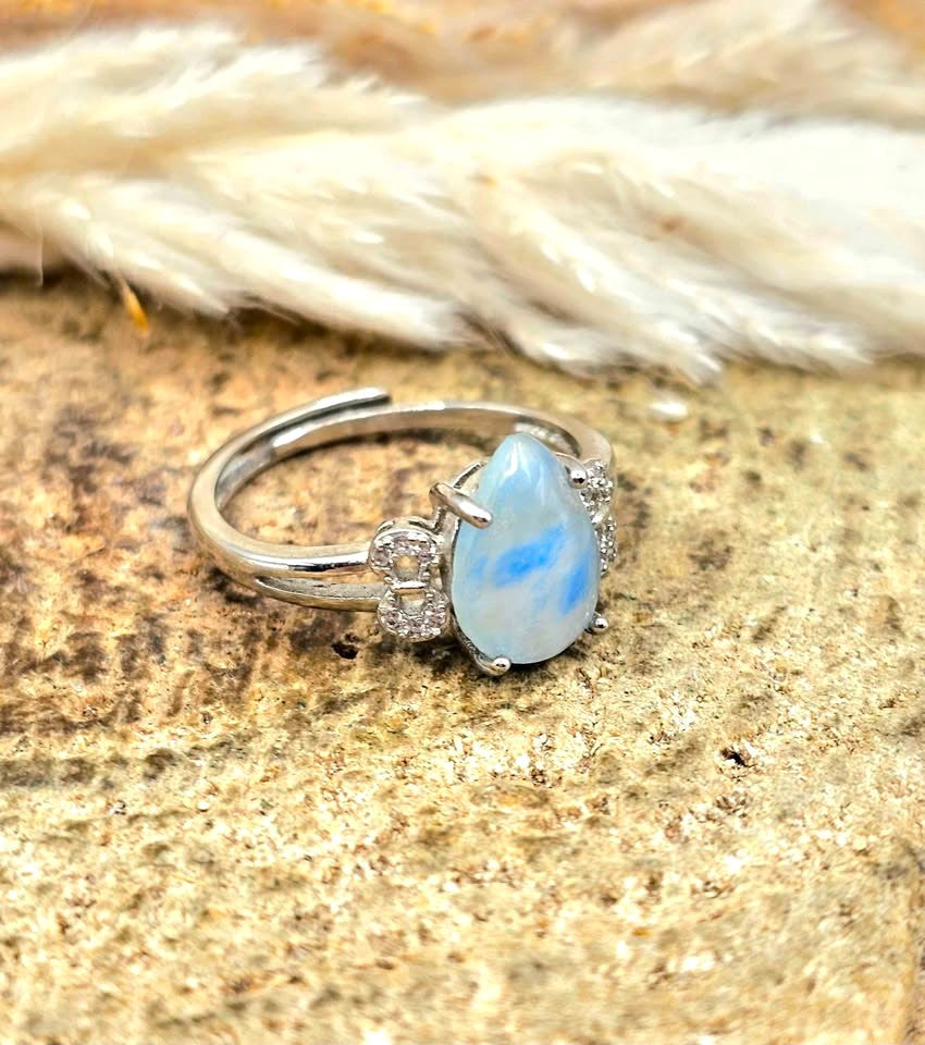 Natural translucent blue kyanite teardrop ring with clear quartz mix and adjustable rhinestone‑stacked band. My Aura Gemstones