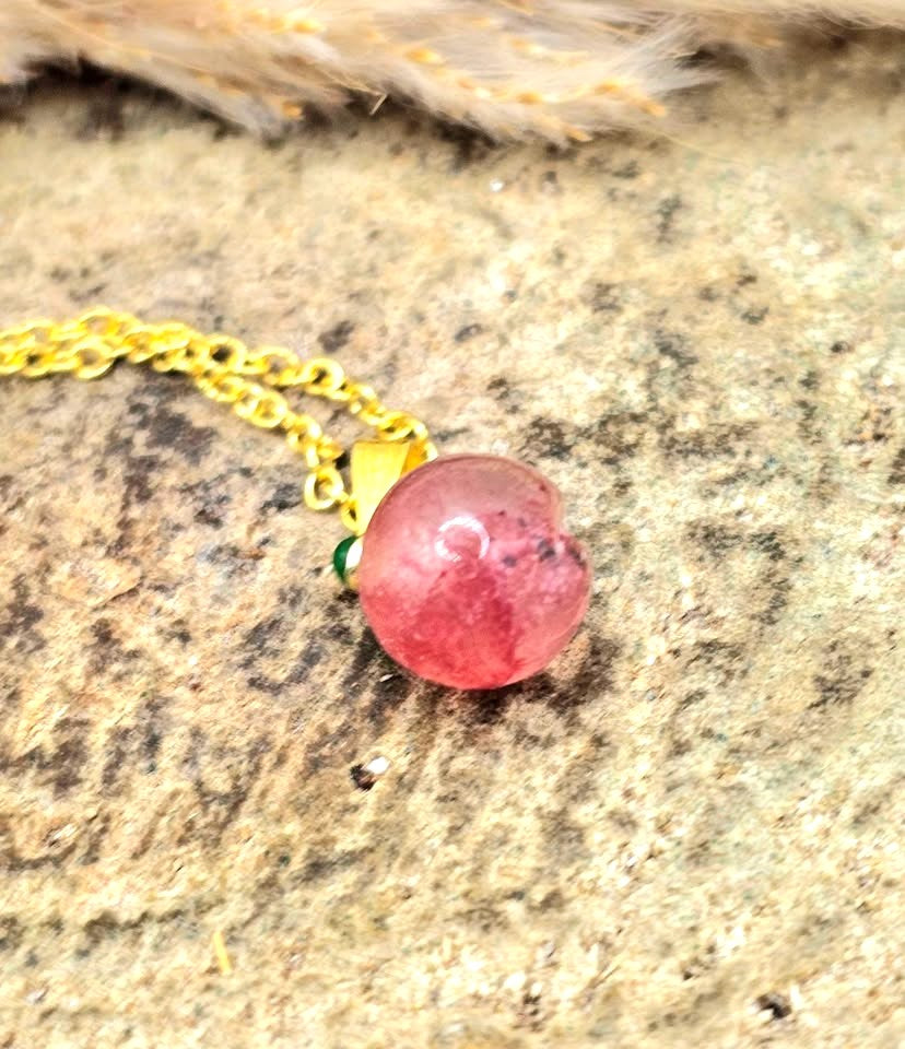 Mini peach pendant carved from natural strawberry quartz with metal leaf and matching gold chain, 18–20 inches-My Aura Gemstones