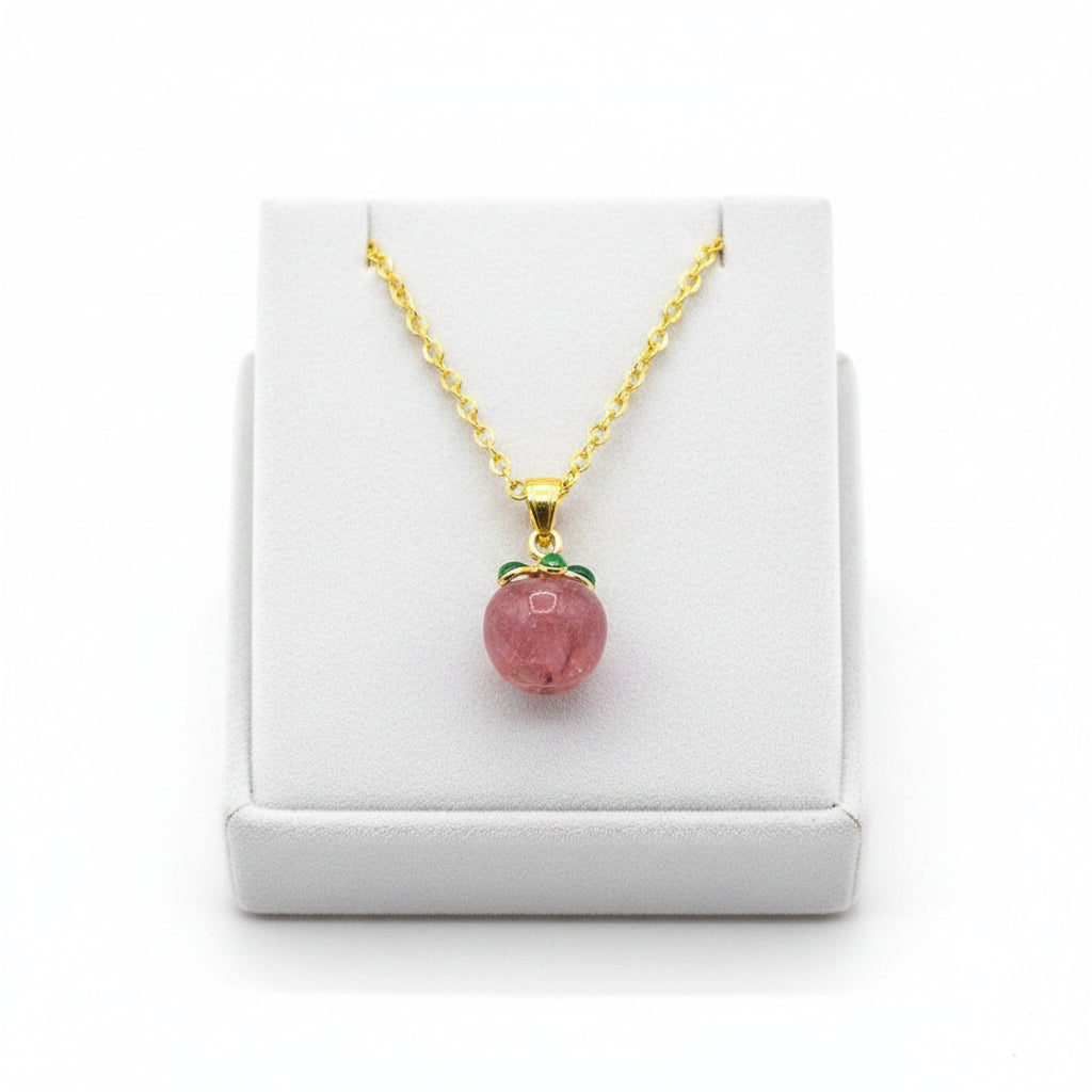 Mini peach pendant carved from natural strawberry quartz with metal leaf and matching gold chain, 18–20 inches-My Aura Gemstones