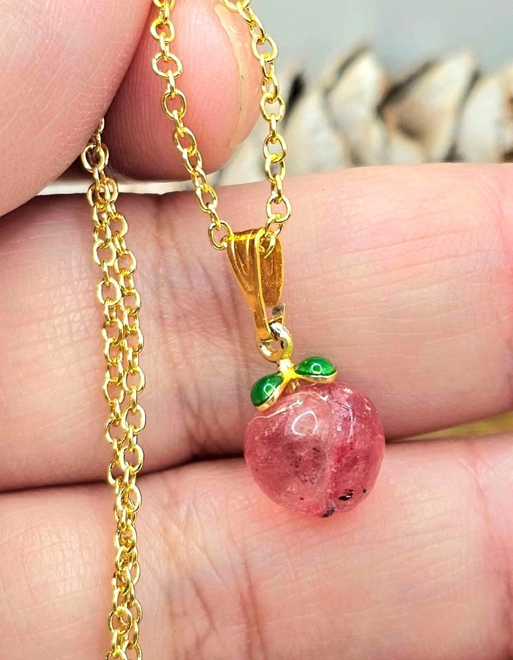 Mini peach pendant carved from natural strawberry quartz with metal leaf and matching gold chain, 18–20 inches-My Aura Gemstones