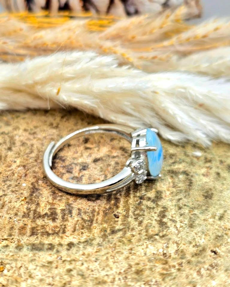 Natural translucent blue kyanite teardrop ring with clear quartz mix and adjustable rhinestone‑stacked band. My Aura Gemstones