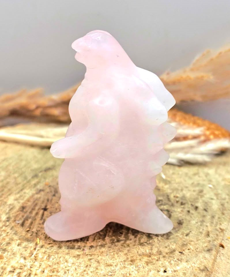 Rose quartz gorilla‑inspired figurine, light pink carving with detailed body, spine, and tail, 2.4" crystal sculpture, side view-My Aura Gemstones