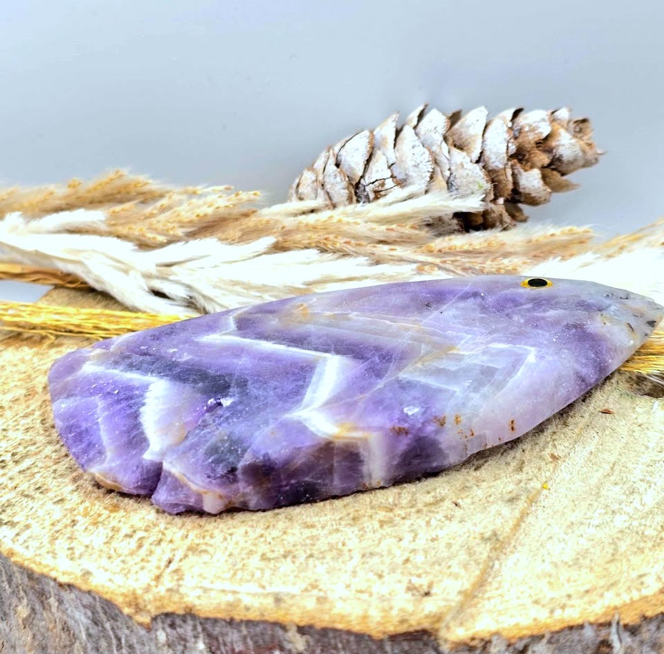 Hand‑carved Dream Amethyst fish figurine with chevron pattern and purple quartz, 4.1 inch crystal carving, flat view-My Aura Gemstones