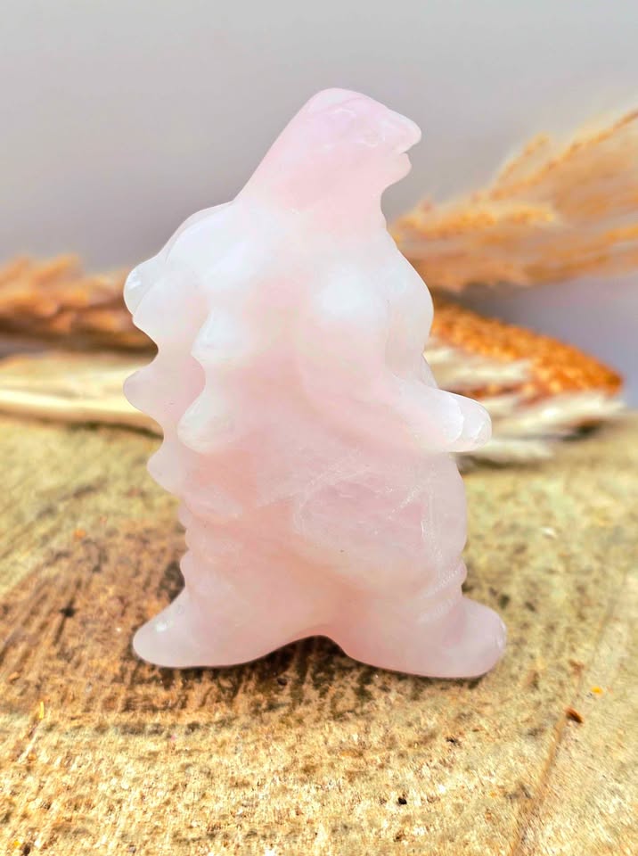 Rose quartz gorilla‑inspired figurine, light pink carving with detailed body, spine, and tail, 2.4" crystal sculpture, side view-My Aura Gemstones