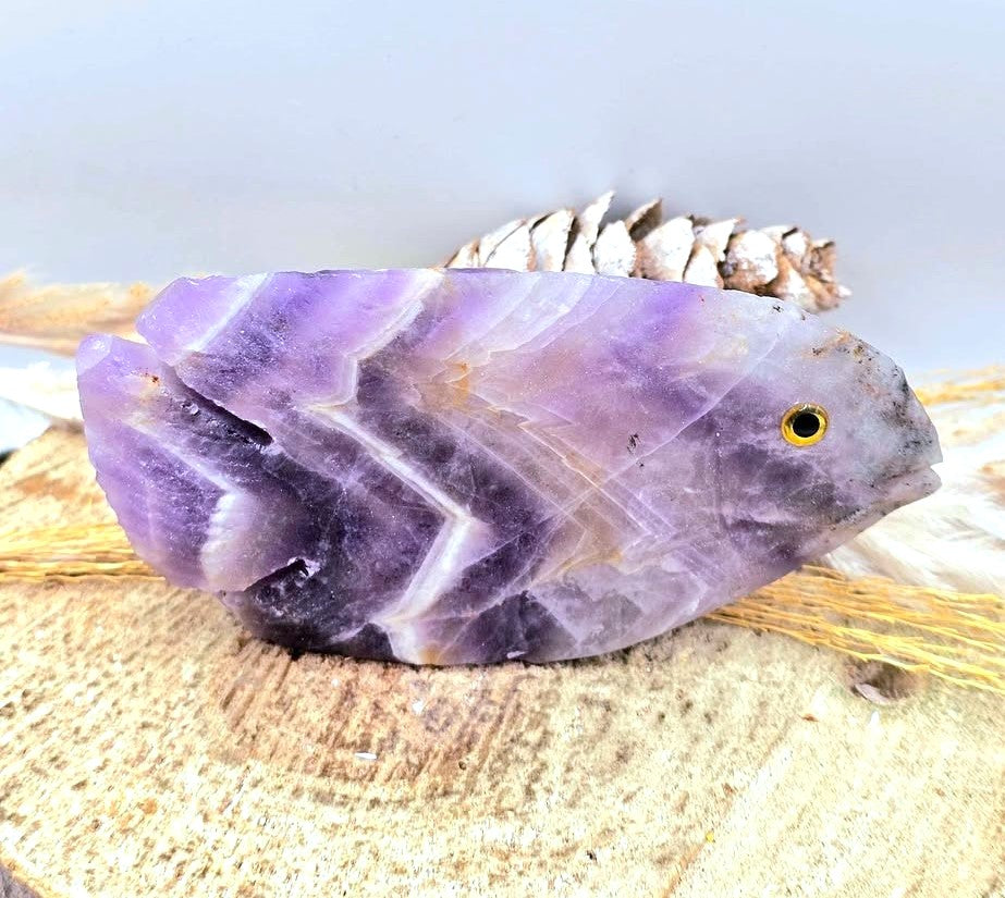 Hand‑carved Dream Amethyst fish figurine with chevron pattern and purple quartz, 4.1 inch crystal carving, top view-My Aura Gemstones