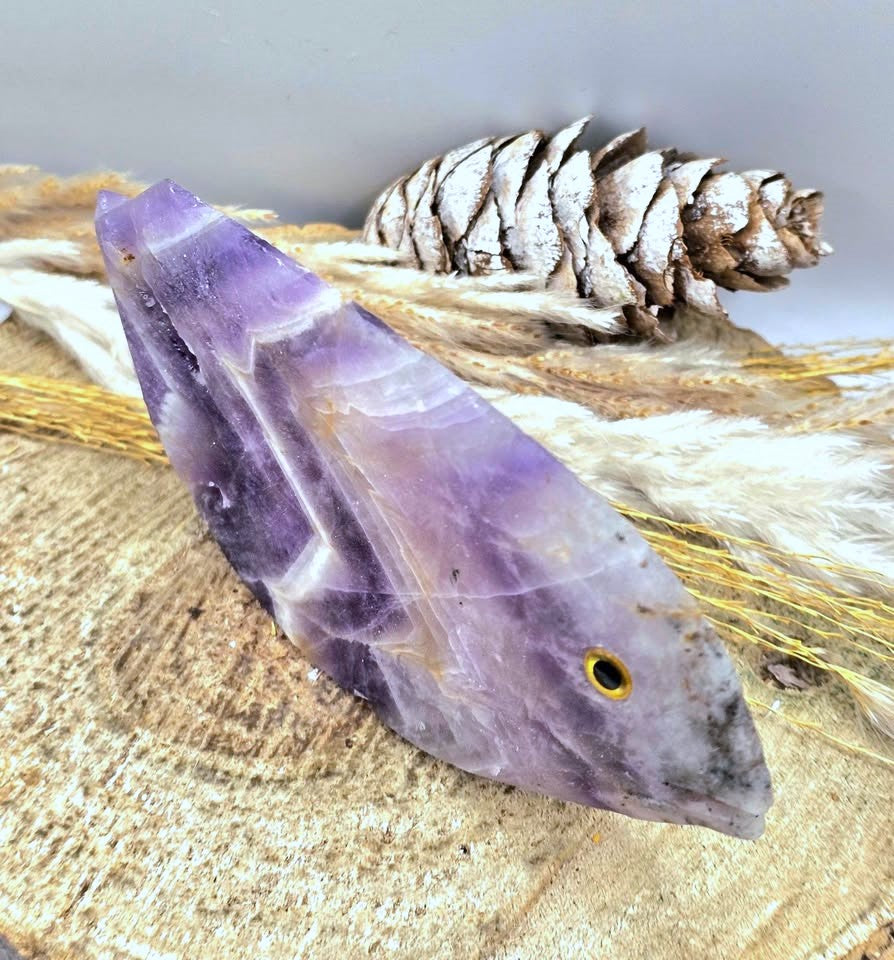 Hand‑carved Dream Amethyst fish figurine with chevron pattern and purple quartz, 4.1 inch crystal carving, top view-My Aura Gemstones