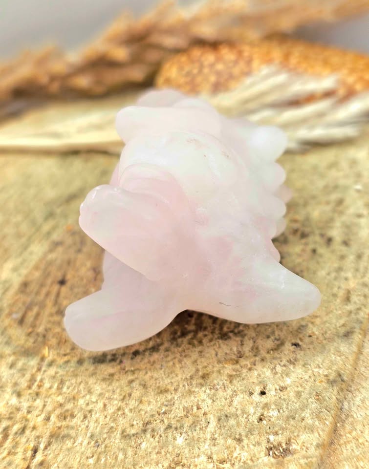 Rose quartz gorilla‑inspired figurine, light pink carving with detailed body, spine, and tail, 2.4" crystal sculpture, bottom view -My Aura Gemstones