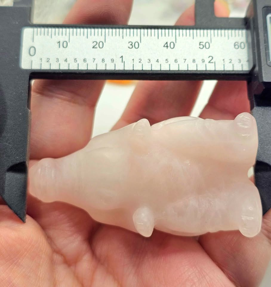 Rose quartz gorilla‑inspired figurine, light pink carving with detailed body, spine, and tail, 2.4" crystal sculpture, measurement -My Aura Gemstones