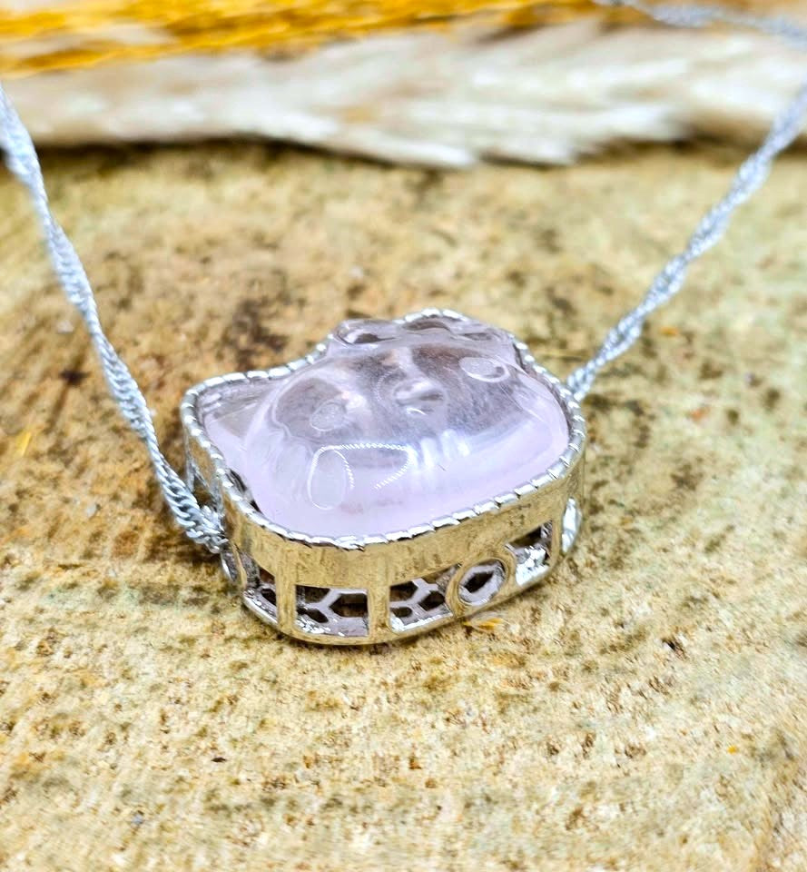 Natural rose quartz rose Hello Kitty charm with light pink transparent crystal and silver‑tone frame at side view-My Aura Gemstones
