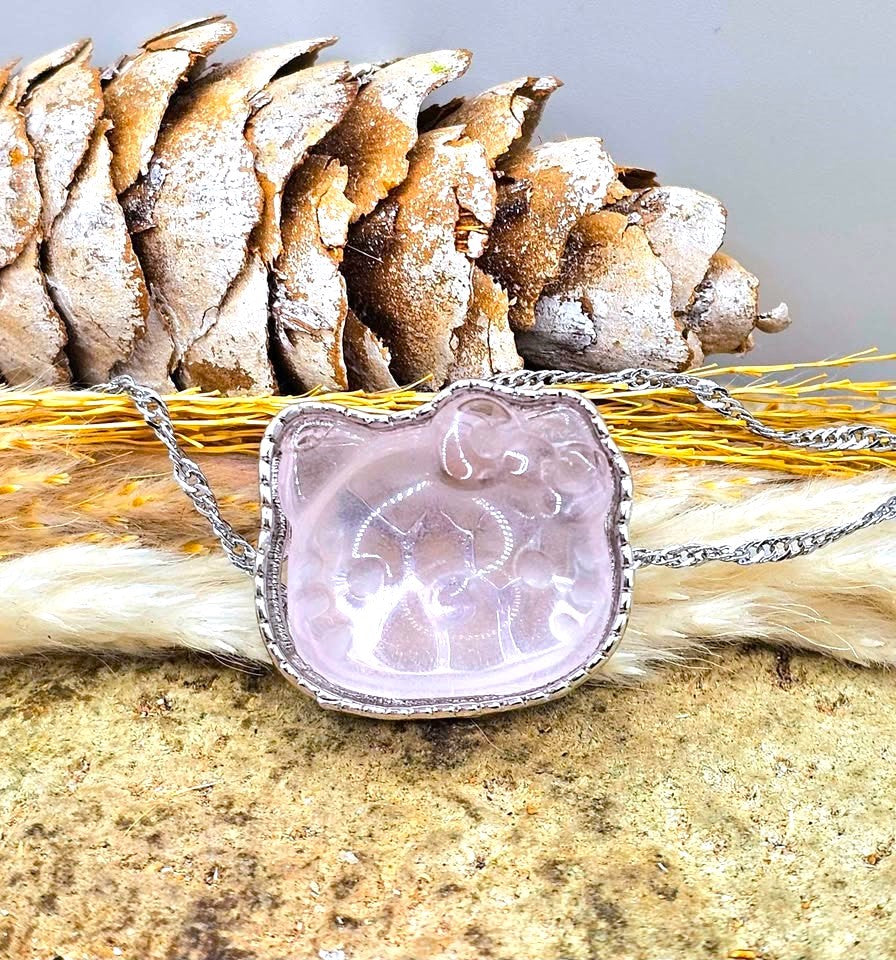 Natural rose quartz rose Hello Kitty charm with light pink transparent crystal and silver‑tone frame-My Aura Gemstones