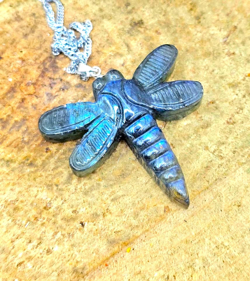 Natural labradorite craved  dragonfly-shaped pendant necklace with iridescent blue in front review at top view-My Aura Gemstones