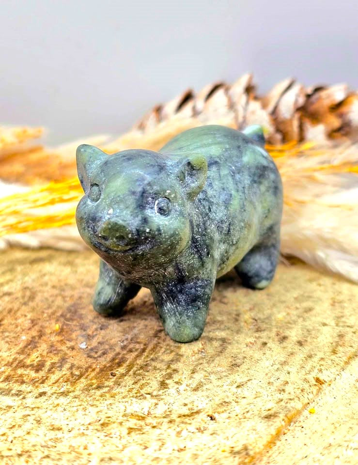 A small Serpentine carved animal figurine of a pig look at the front-My Aura Gemstones