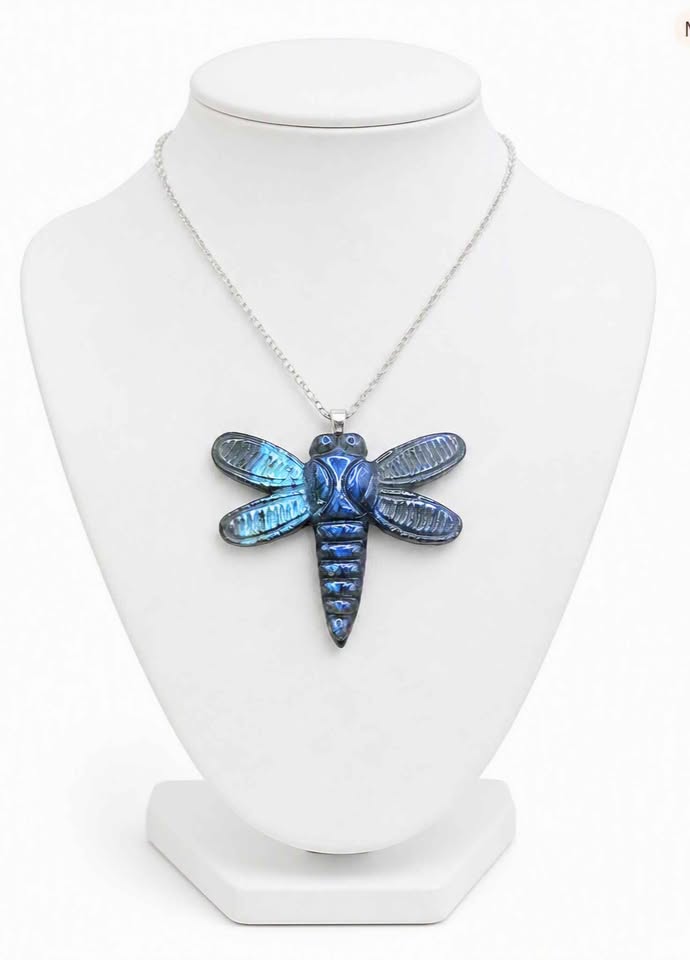 Natural labradorite craved  dragonfly-shaped pendant necklace with iridescent blue in front review displays in jewelry stand-My Aura Gemstones