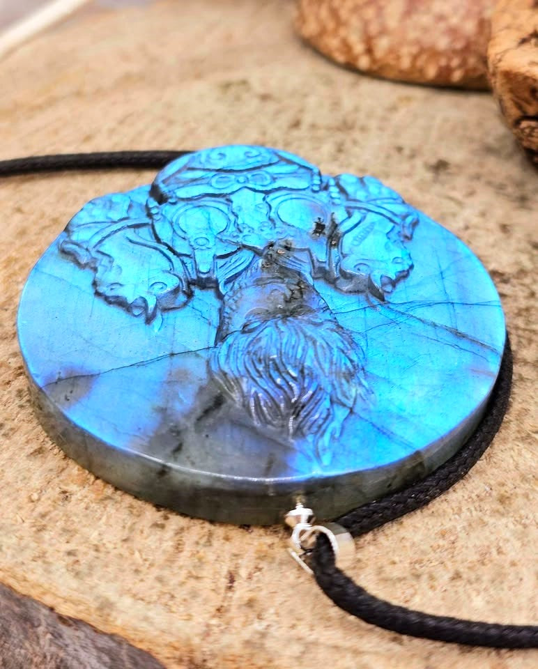 A labradorite carved round pendant necklace featuring a carved of powerful monkey king in front view on another top slice-My Aura Gemstones
