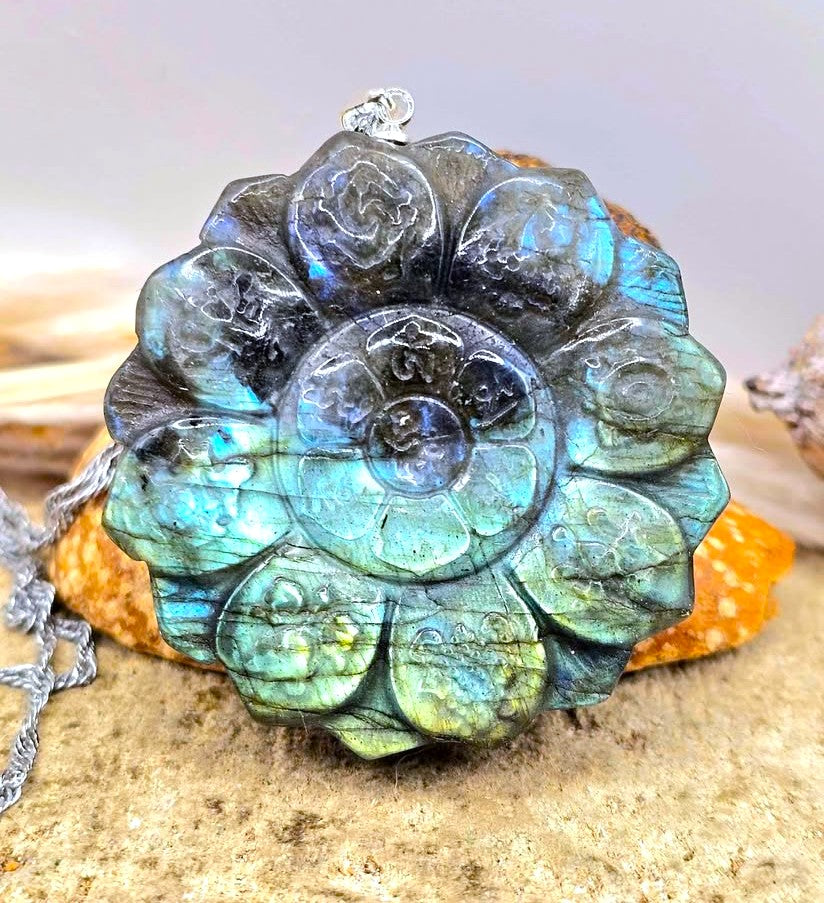 Natural Labradorite Tibet Buddhism Eight Auspicious Lotus Double Carving Pendant Necklace display wood slice in front view