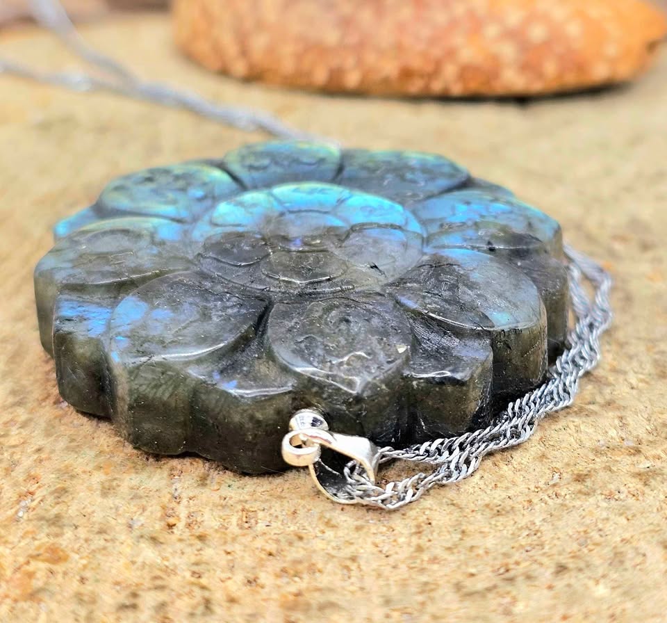Natural Labradorite Tibet Buddhism Eight Auspicious Lotus Double Carving Pendant Necklace display on wood stand in side view.