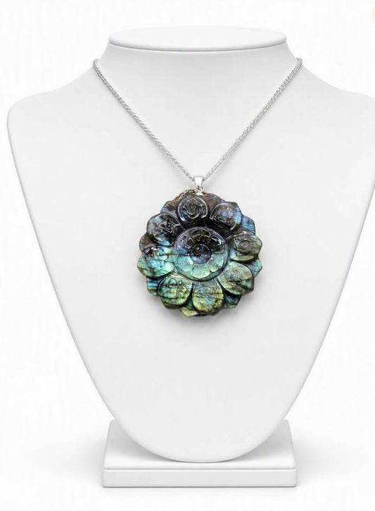 Natural Labradorite Tibet Buddhism Eight Auspicious Lotus Double Carving Pendant Necklace displays in jewelry stand.