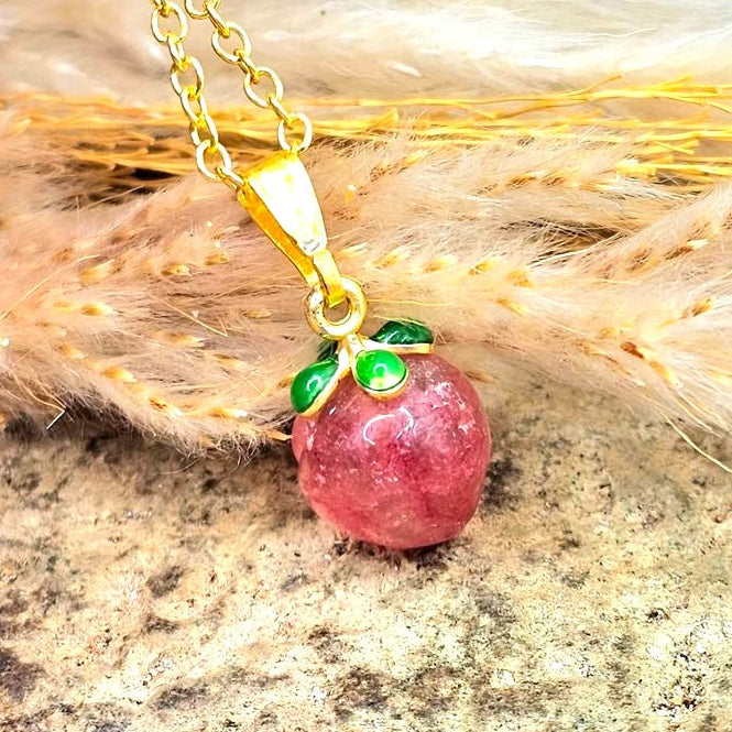 Mini peach pendant carved from natural strawberry quartz with metal leaf and matching gold chain, 18–20 inches-My Aura Gemstones