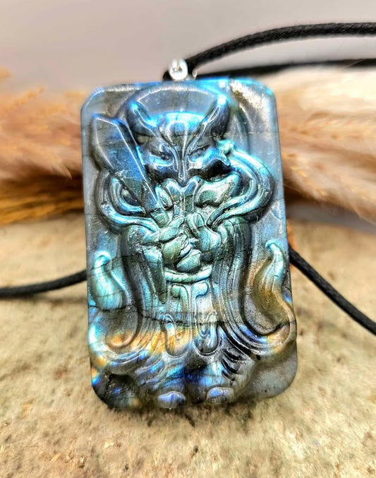 A rectangular carved pendant necklace featuring a fox warrior god figure made from nature labradorite front view-My Aura Gemstones