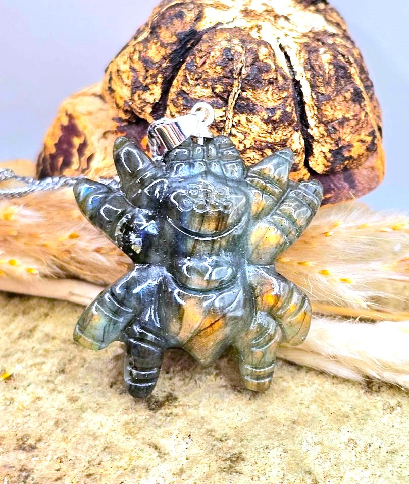 Natural Labradorite Spider Pendant Necklace Display on wood slice -My Sura Gemstones