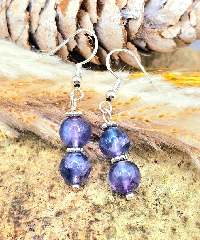 Handcrafted purple fluorite dangle earrings with 7mm lavender‑to‑violet beads, silver‑tone spacers, and S925 stamped fishhook ear wires.-My Aura Gemstones