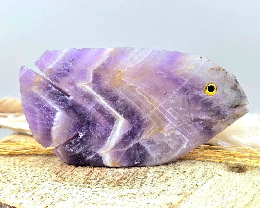 Hand‑carved Dream Amethyst fish figurine with chevron pattern and purple quartz, 4.1 inch crystal carving, front view-My Aura Gemstones