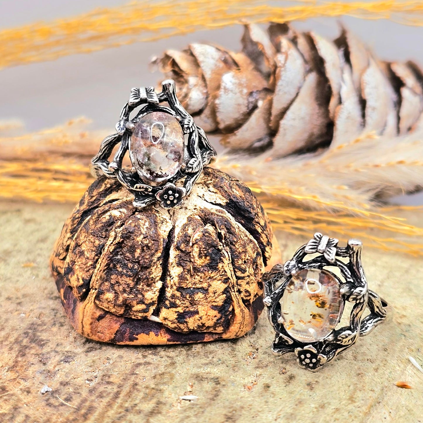 Garden quartz ring with high‑clarity crystal and green‑brown inclusions, floral wood‑branch band with butterfly, adjustable size-My Aura Gemstones